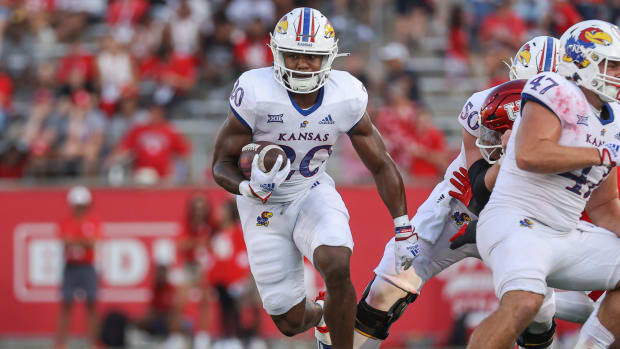 Sep 17, 2022; Houston, Texas, USA; Kansas Jayhawks running back Daniel Hishaw Jr. (20) runs with the ball during the fourth quarter against the Houston Cougars at TDECU Stadium. Mandatory Credit: Troy Taormina-USA TODAY Sports